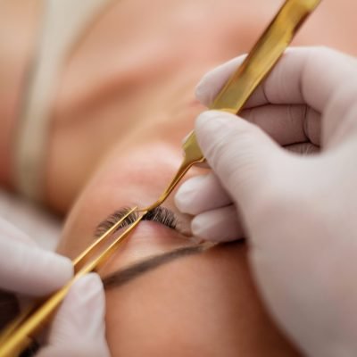 Procedure of eyelash extension in salon by cosmetician Procedure of eyelashes extension in salon